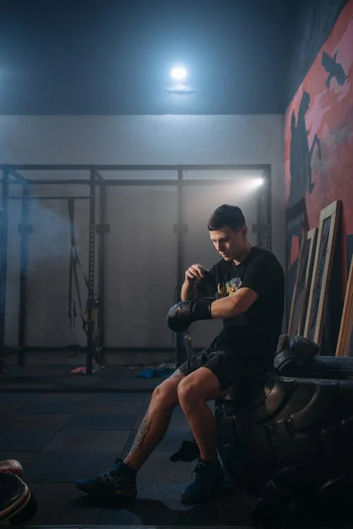 boxer putting on gloves