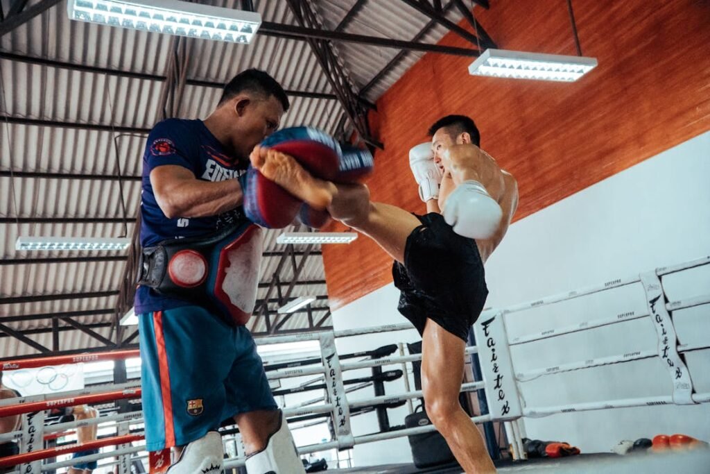 man doing kickboxing in martial arts school